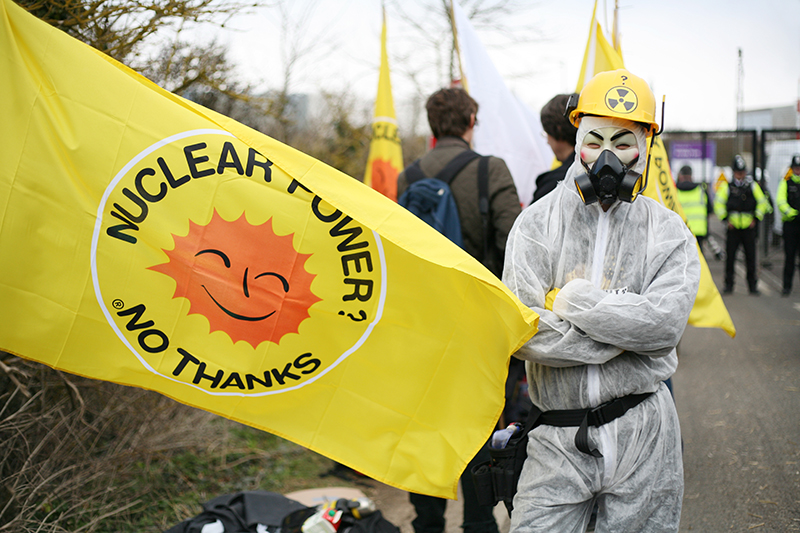 Masked protester at Hinkley Point nuclear power station where hundreds gathered to mark the <br />first anniversary of the Fukushima disaster and to call for a halt to the development of Hinkley C.<br />UNITED KINGDOM, Bridgwater | 2012