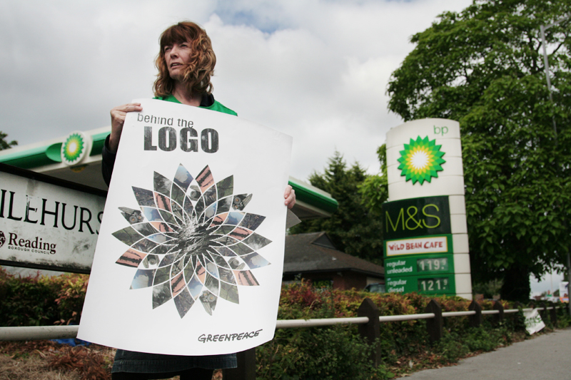 Berkshire Greenpeace activist reveals the pollution behind BP's logo, a company that, after rebranding <br />itself as "Beyond Petroleum", plans to invest in tar sands, the dirtiest oil currently being produced.<br />UNITED KINGDOM, Reading | 2010